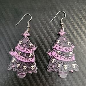 "Merry Creepmas" gothic black and purple Christmas tree with skull ornaments